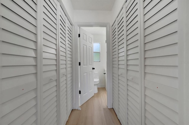 corridor featuring light wood-type flooring