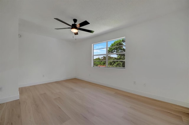 unfurnished room featuring ceiling fan, a textured ceiling, and light hardwood / wood-style floors