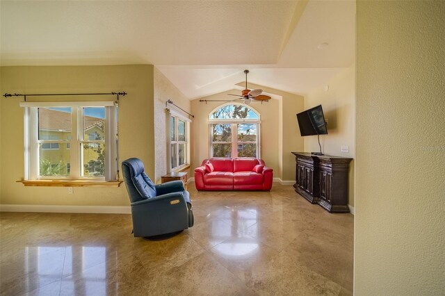 living area with lofted ceiling and ceiling fan