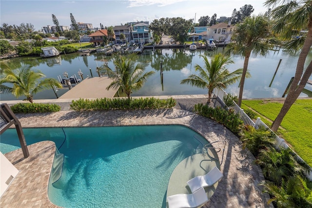 view of pool featuring a fenced in pool, a residential view, a water view, and fence