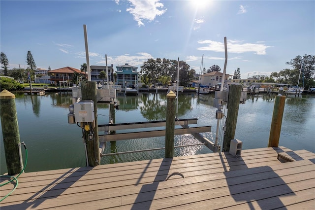 dock area featuring a water view and boat lift