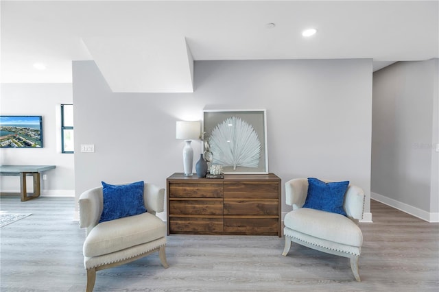 sitting room with recessed lighting, wood finished floors, and baseboards