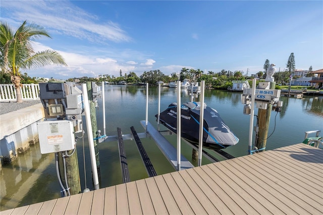 view of dock featuring a water view and boat lift