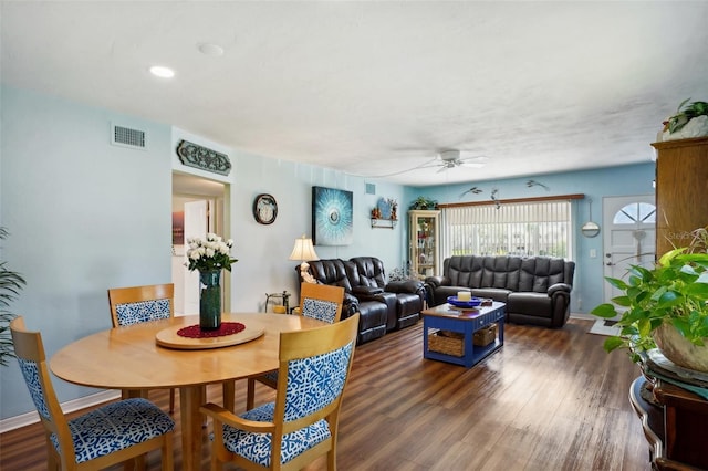 living room with ceiling fan and dark hardwood / wood-style floors