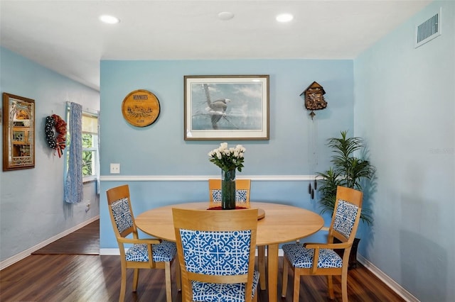 dining room with dark wood-type flooring