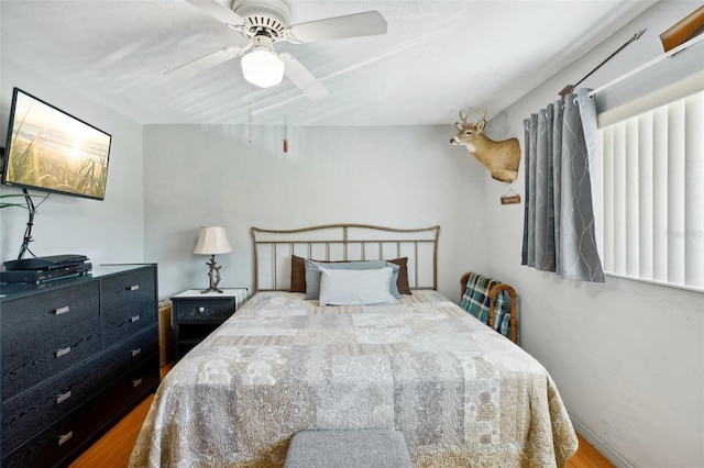 bedroom featuring ceiling fan and hardwood / wood-style flooring