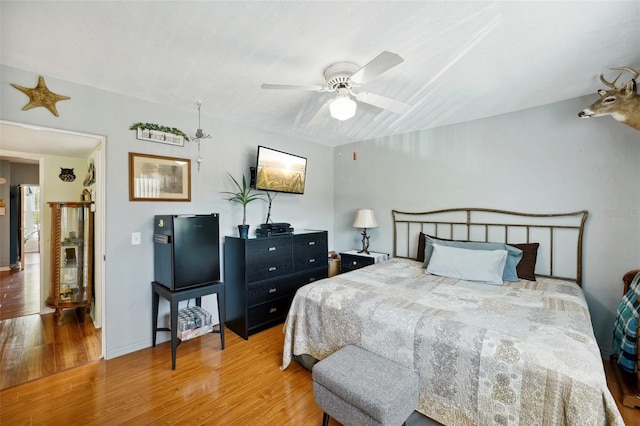 bedroom featuring ceiling fan and hardwood / wood-style flooring