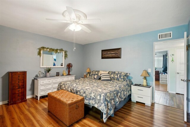 bedroom with hardwood / wood-style flooring and ceiling fan