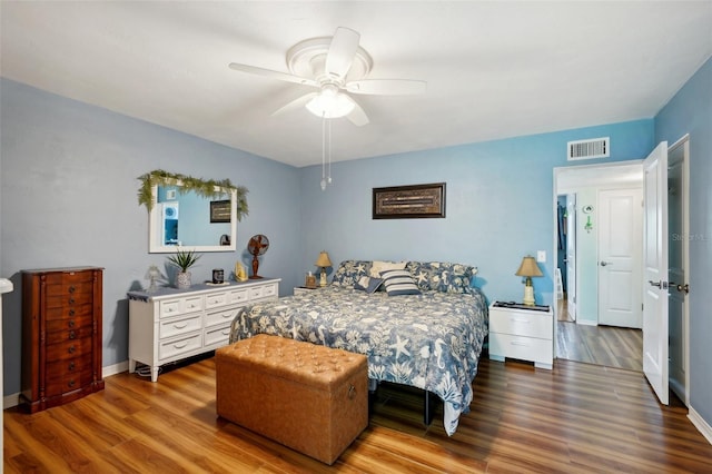 bedroom with ceiling fan and wood-type flooring