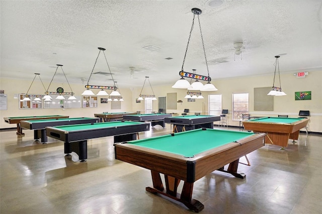 recreation room featuring concrete flooring, pool table, ceiling fan, and a textured ceiling