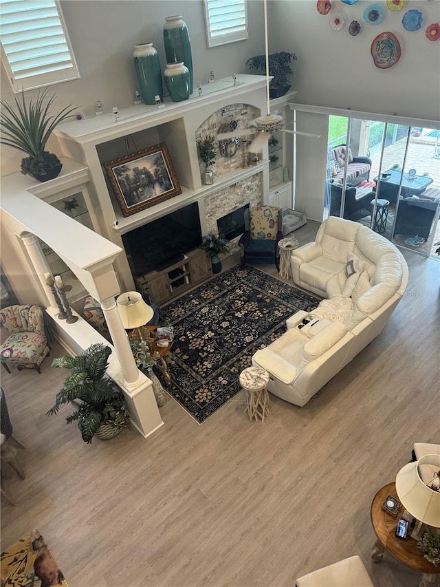 living room with wood finished floors and a fireplace