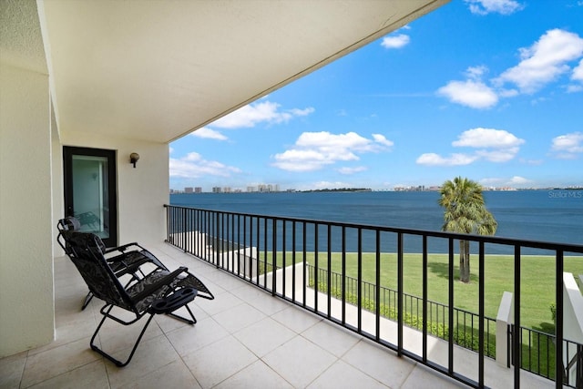 balcony featuring a water view