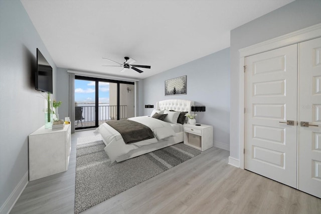 bedroom with light hardwood / wood-style flooring, access to exterior, and ceiling fan