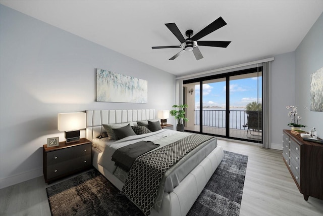 bedroom featuring access to exterior, ceiling fan, and light hardwood / wood-style floors