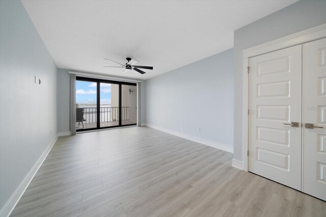 unfurnished room featuring ceiling fan and light hardwood / wood-style flooring