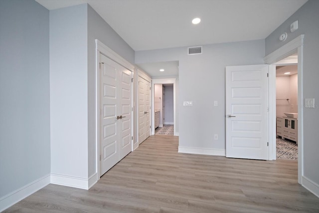 unfurnished bedroom featuring light hardwood / wood-style flooring