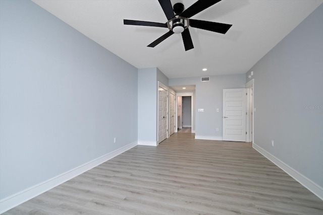 interior space with light wood-type flooring and ceiling fan