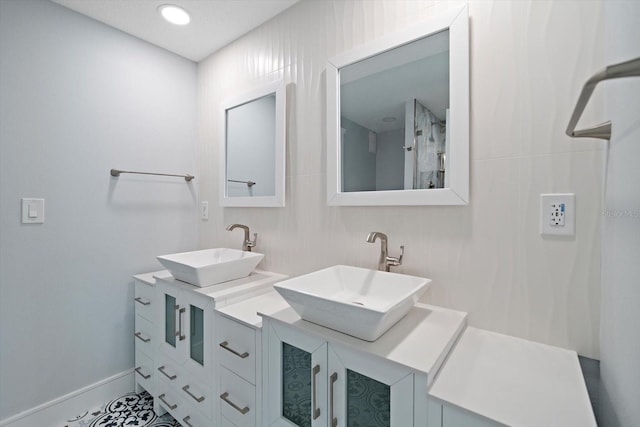 bathroom with vanity and tile patterned floors