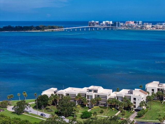 birds eye view of property with a water view