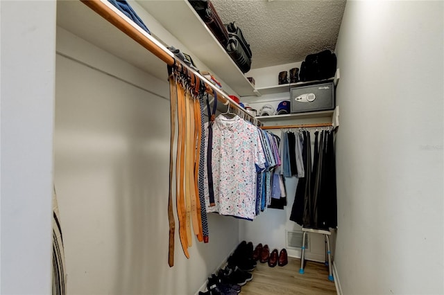 walk in closet featuring light hardwood / wood-style floors