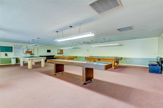 recreation room featuring a textured ceiling, carpet flooring, and pool table