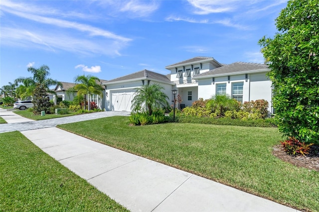 view of front facade with a garage and a front yard