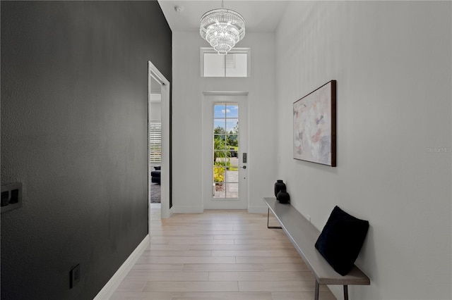 interior space featuring light hardwood / wood-style flooring and a chandelier