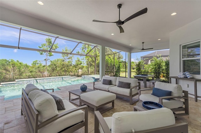 view of patio with a lanai, outdoor lounge area, and ceiling fan