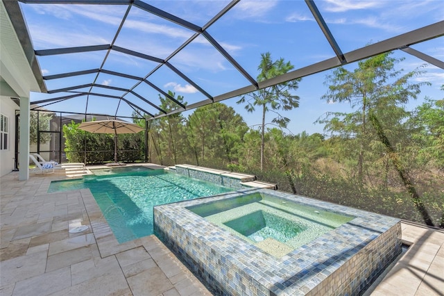 view of swimming pool with glass enclosure, an in ground hot tub, and a patio