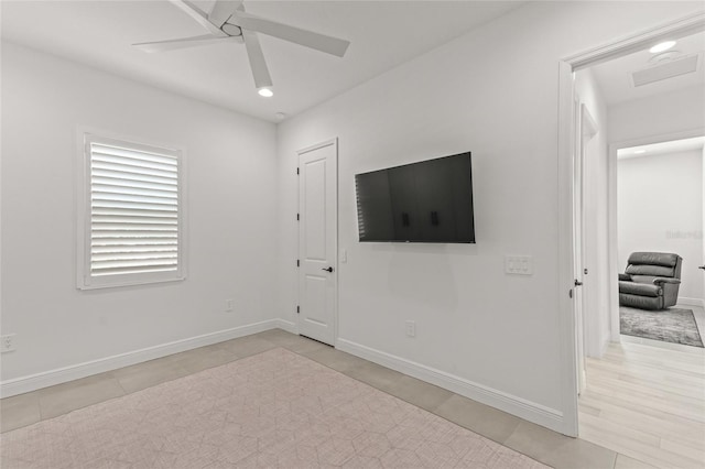 interior space with light wood-type flooring and ceiling fan