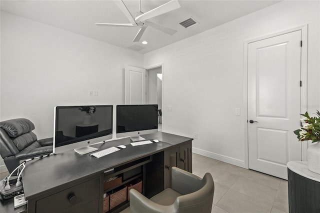 tiled home office featuring ceiling fan