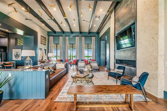 living room featuring wood-type flooring and a fireplace