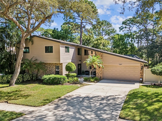 view of front of house featuring a garage and a front yard