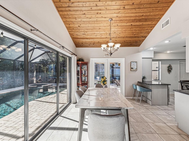 unfurnished dining area featuring wooden ceiling, light tile patterned floors, an inviting chandelier, and vaulted ceiling