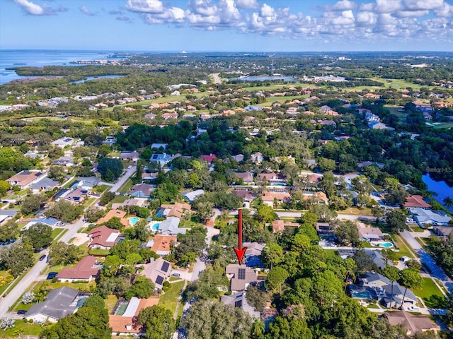 drone / aerial view with a water view