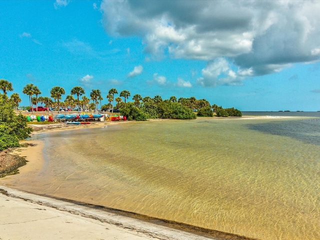 surrounding community featuring a water view