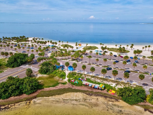 bird's eye view featuring a water view and a view of the beach