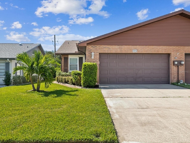 ranch-style house with a garage and a front yard