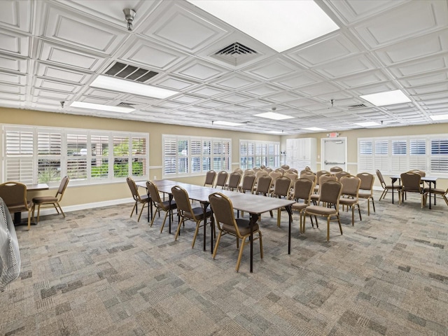 dining room with coffered ceiling and carpet floors