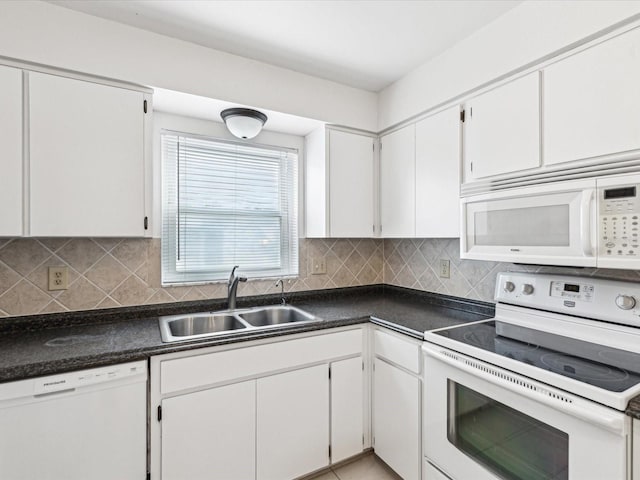 kitchen with tasteful backsplash, white appliances, sink, and white cabinets