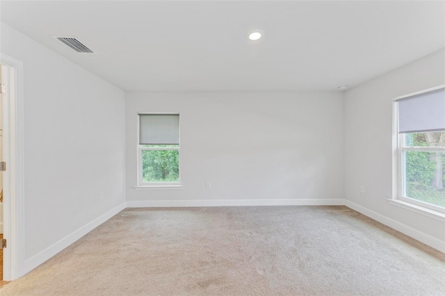 empty room featuring light colored carpet