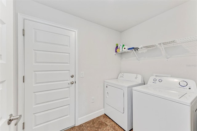 washroom with tile patterned floors and separate washer and dryer