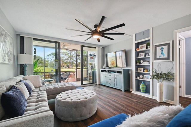 living room featuring a wall of windows, ceiling fan, and dark hardwood / wood-style floors