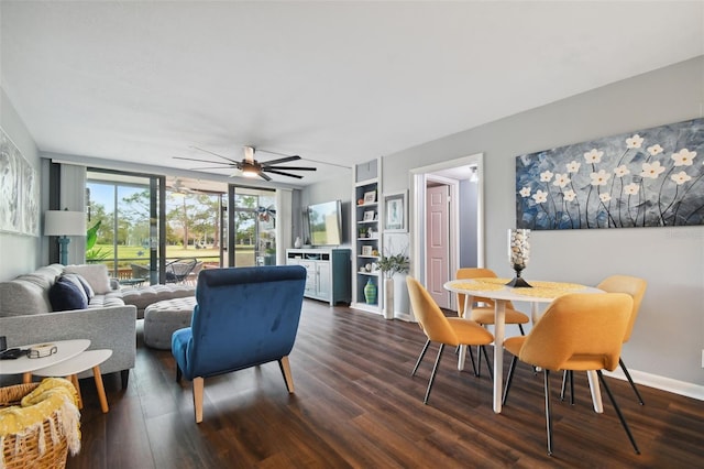 living room featuring dark hardwood / wood-style flooring, built in shelves, and ceiling fan