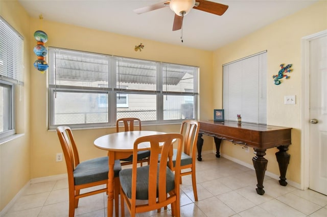 dining space featuring ceiling fan and light tile patterned flooring