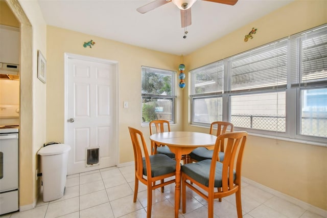 6220 5th Ave S, Saint Petersburg, FL 33707 - dining space with ceiling fan, baseboards, and light tile patterned flooring