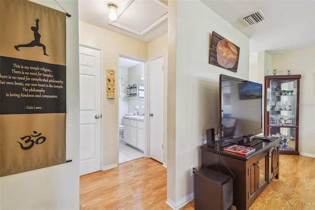 corridor featuring light hardwood / wood-style floors