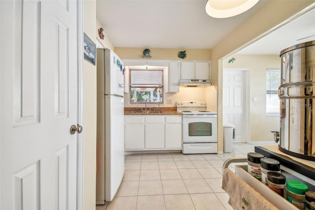 kitchen with white cabinetry, sink, range hood, white appliances, and light tile patterned floors