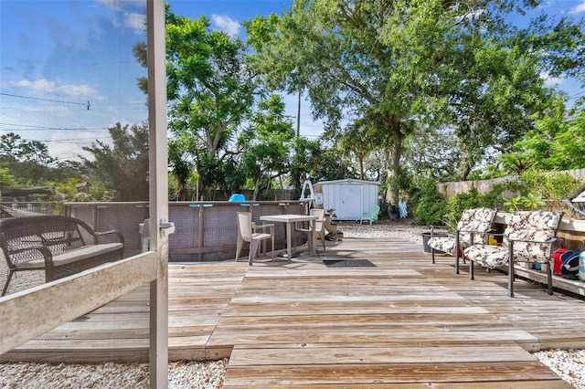 deck featuring a storage shed