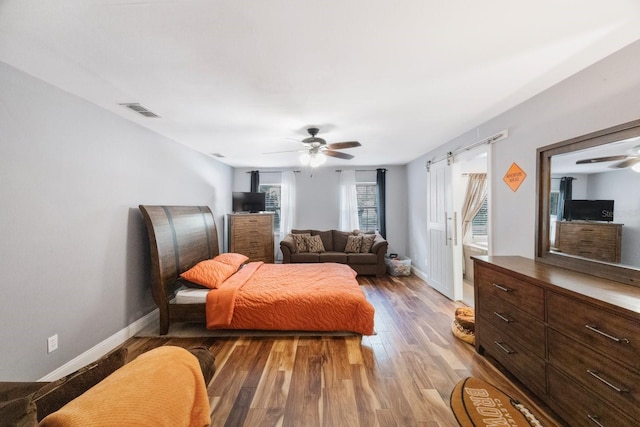 bedroom featuring ceiling fan and wood-type flooring